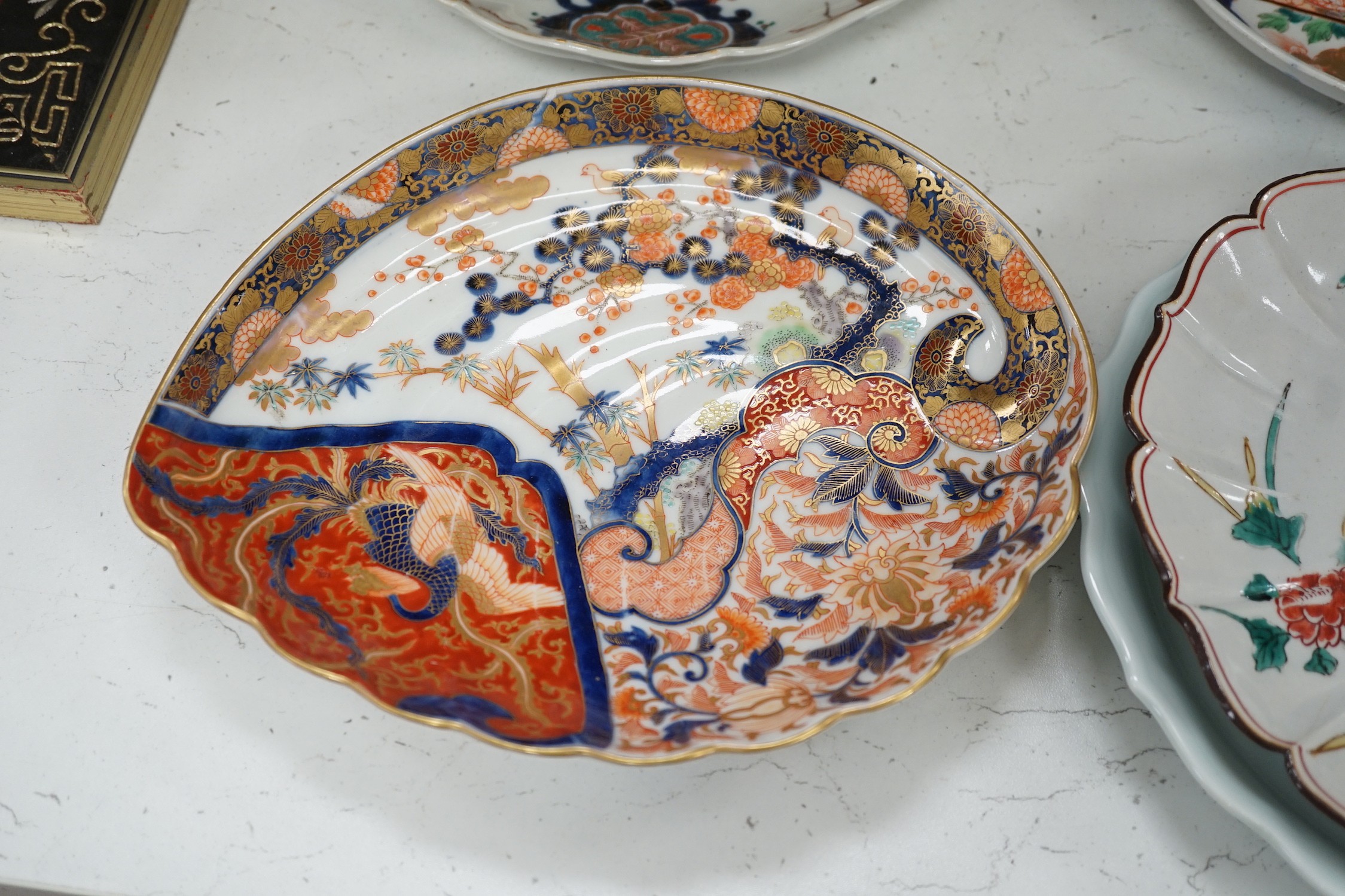 A group of 19th/20th century Japanese porcelain and pottery dishes. Largest 33cm diameter